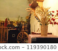 Atmospheric interior decor with a bouquet of ears of corn and a spinning wheel in a restaurant in Crimea 119390180