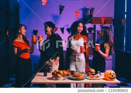 Joyful office Halloween party with coworkers in costumes, celebrating with drinks and laughter, fostering teamwork and festive spirit 119390903