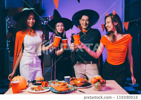 Joyful office Halloween party with coworkers in costumes, celebrating with drinks and laughter, fostering teamwork and festive spirit 119390918