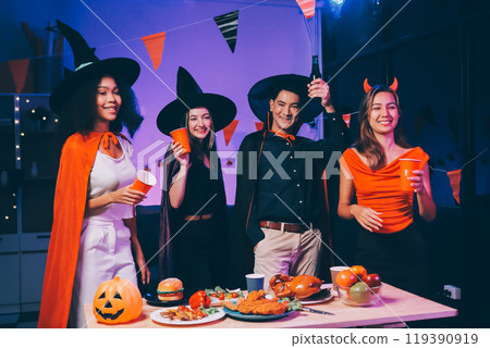 Joyful office Halloween party with coworkers in costumes, celebrating with drinks and laughter, fostering teamwork and festive spirit 119390919