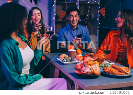 Joyful office Halloween party with coworkers in costumes, celebrating with drinks and laughter, fostering teamwork and festive spirit 119391001