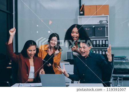 Young corporate employees sitting in office looking at laptop screen reading good news excited happy team diverse people celebrating victory win command success excellent result professional teamwork Young corporate employees sitting in office looking at laptop screen reading good news excited happy team diverse people celebrating victory win command success excellent result professional teamwork 119391007
