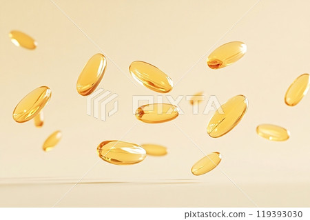 Golden vitamin pills floating on a light yellow background 119393030