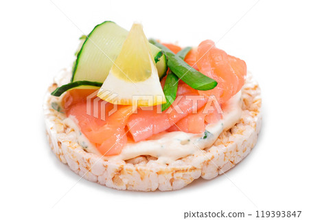 Rice Cake Sandwich with Fresh Salmon, Lemon and Greens - Isolated Rice Cake Sandwich with Fresh Salmon, Lemon and Greens - Isolated 119393847