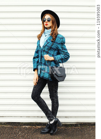 Fashion young woman model wearing black hat checkered coat jacket handbag on white background 119395003