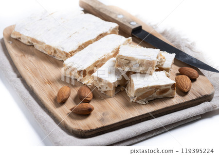 Christmas almond nougat isolated on white background. 119395224
