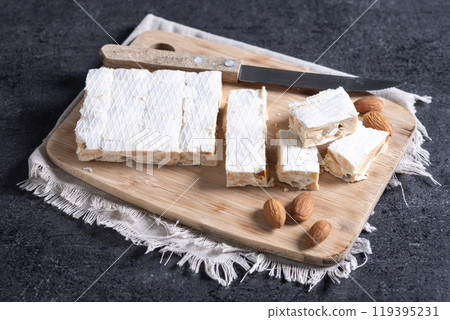 Christmas almond nougat on black slate background 119395231