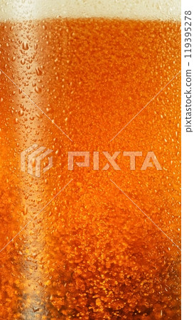 Closeup of beer bubbles in a glass. 119395278