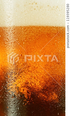 Closeup of beer bubbles in a glass. 119395280