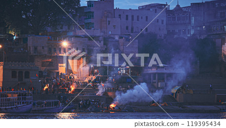 Varanasi, India. Funeral Rites Of Cremation At Harishchandra Ghat. Harishchandra Ghat Is One Of Only Two Ghats Serving As Cremation Sites Along Ganges River. Fire That Never Stops Sends Souls To Varanasi, India. Funeral Rites Of Cremation At Harishchandra Ghat. Harishchandra Ghat Is One Of Only Two Ghats Serving As Cremation Sites Along Ganges River. Fire That Never Stops Sends Souls To 119395434