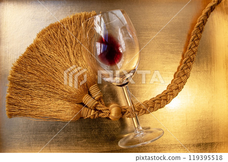 Used wine glasses, two half empty glasses of red wine on a golden tray background Used wine glasses, two half empty glasses of red wine on a golden tray background 119395518