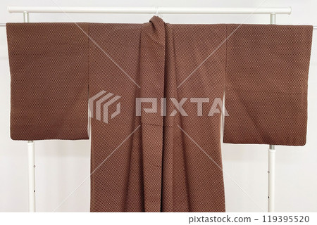 Colorful kimono robe on a hanger, promo photo for an online women's clothing store Colorful kimono robe on a hanger, promo photo for an online women's clothing store 119395520