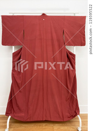 Colorful kimono robe on a hanger, promo photo for an online women's clothing store Colorful kimono robe on a hanger, promo photo for an online women's clothing store 119395522