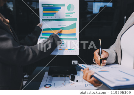 Business people are analyzing and planning business strategies. 119396309