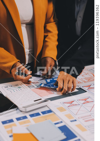 The designer team is designing the uxui system to make the uxui system work well on new phones and support system updates. Website development concept UI UX front end designer 119396362