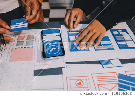 The designer team is designing the uxui system to make the uxui system work well on new phones and support system updates. Website development concept UI UX front end designer The designer team is designing the uxui system to make the uxui system work well on new phones and support system updates. Website development concept UI UX front end designer 119396368