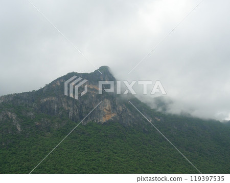 Cloud and fog cover limestone mountain in the rainy season, Green forest and rock at Khao Sam Roi Yot National Park, Thailand 119397535