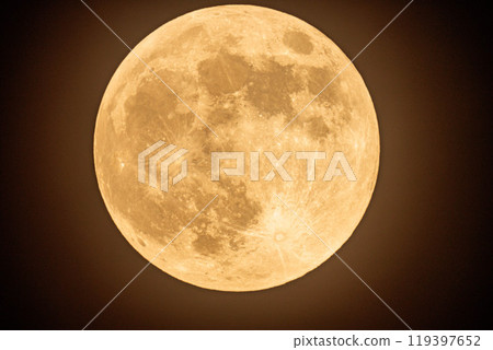 A full moon floating in a night sky with thin clouds 119397652