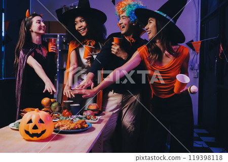 Joyful office Halloween party with coworkers in costumes, celebrating with drinks and laughter, fostering teamwork and festive spirit Joyful office Halloween party with coworkers in costumes, celebrating with drinks and laughter, fostering teamwork and festive spirit 119398118