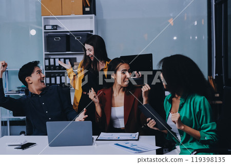 Young corporate employees sitting in office looking at laptop screen reading good news excited happy team diverse people celebrating victory win command success excellent result professional teamwork Young corporate employees sitting in office looking at laptop screen reading good news excited happy team diverse people celebrating victory win command success excellent result professional teamwork 119398135