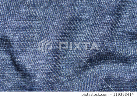 Close-up of blue denim fabric with subtle textured pattern creating a soft Close-up of blue denim fabric with subtle textured pattern creating a soft 119398414