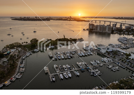 Sarasota Bay marina with luxury yachts and Florida city architecture at sunset. High-rise office buildings in downtown district. Real estate development in Florida. USA travel destination 119399179
