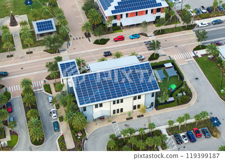 Solar photovoltaic panels installed on top of Florida office buildings for producing clean ecological electric energy. Renewable electricity with zero emission concept Solar photovoltaic panels installed on top of Florida office buildings for producing clean ecological electric energy. Renewable electricity with zero emission concept 119399187