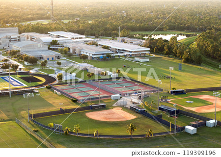 Sports facilities at public school in Florida, USA. American football stadium, tennis court and baseball diamond sport infrastructure Sports facilities at public school in Florida, USA. American football stadium, tennis court and baseball diamond sport infrastructure 119399196