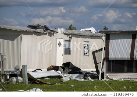 Property damage from strong hurricane winds. Mobile homes in Florida residential area with destroyed rooftops. Consequences of natural disaster 119399476