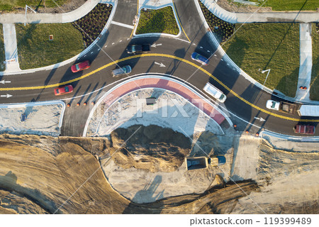 Roundabout intersection construction in North Port, Florida. Development of American road circle with moving traffic cars. Urban circular transportation crossroads 119399489