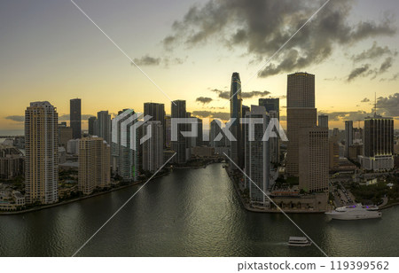 Evening urban landscape of downtown district of Miami Brickell in Florida, USA. Skyline with dark high skyscraper buildings in modern American megapolis Evening urban landscape of downtown district of Miami Brickell in Florida, USA. Skyline with dark high skyscraper buildings in modern American megapolis 119399562