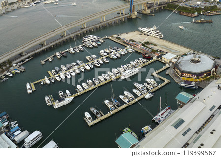 Expensive yachts and motorboats docked in Biscayne Bay harbor in downtown district of Miami, Florida. Marina bay with luxury sailboats 119399567