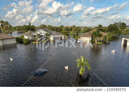 Flooded Florida street with stuck car after hurricane Debby rainfall surrounded with water. Consequences of natural disaster 119399575