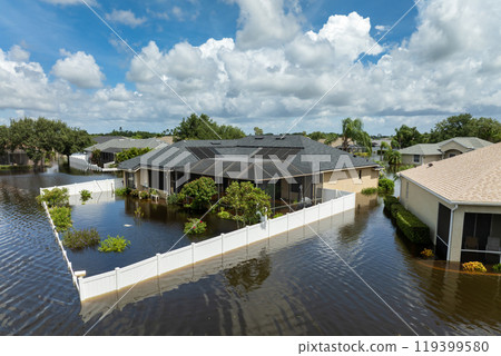 Flooded houses from hurricane rainfall water in Florida residential community. Aftermath of natural disaster in USA south Flooded houses from hurricane rainfall water in Florida residential community. Aftermath of natural disaster in USA south 119399580