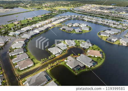 Flooded houses from hurricane rainfall water in Florida residential community. Aftermath of natural disaster in USA south 119399581