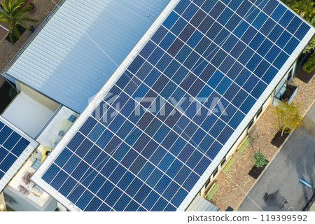 Florida office building with solar roof. Blue photovoltaic panels for producing clean ecological electric energy. Investing in renewable electricity concept 119399592