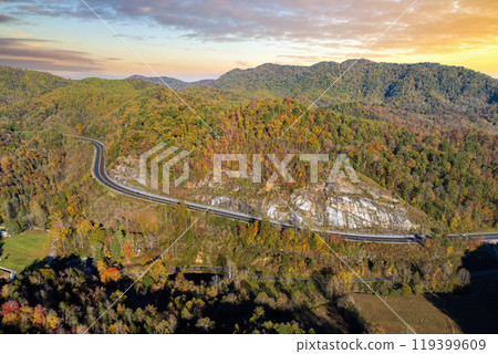 Highway road in North Carolina Appalachian mountains in fall season. Expressway lanes for fast passing of car traffic Highway road in North Carolina Appalachian mountains in fall season. Expressway lanes for fast passing of car traffic 119399609
