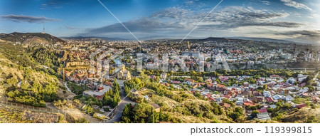 Drone panorama of Tbilisi, Georgia, with the Kura River at sunrise showcasing the cityscape 119399815