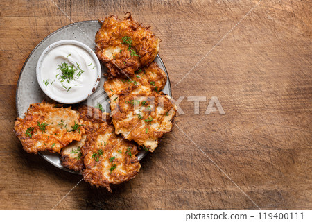 Potato latkes with herbs and sour cream 119400111