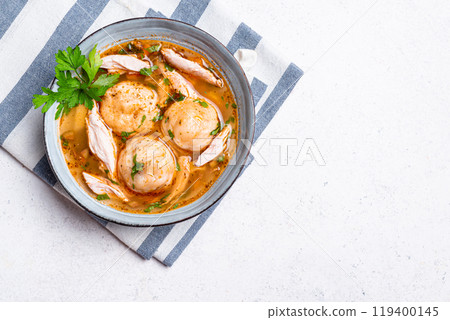 Matzoh ball and chicken soup 119400145