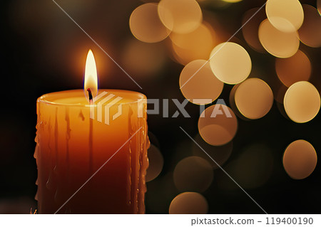 candle with background of out of focus lights in the background. Christmas background with copy space 119400190