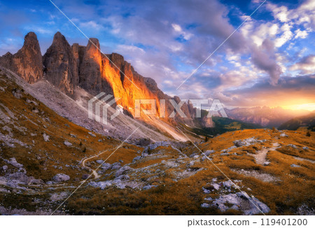Landscape with mountain peaks, rocks, alpine meadows at sunset 119401200