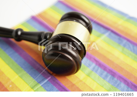 Gavel for judge lawyer on rainbow flag, symbol of LGBT pride month. 119401665