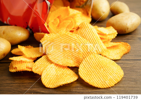 Potato chips , delicious BBQ seasoning spicy for crips, thin slice deep fried snack fast food. Potato chips , delicious BBQ seasoning spicy for crips, thin slice deep fried snack fast food. 119401739