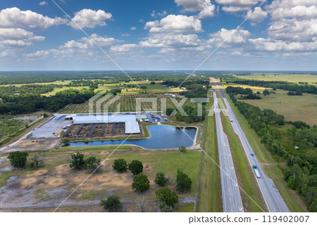 Cow feed lot with meat cows. Cattle stockyard on farm in USA 119402007