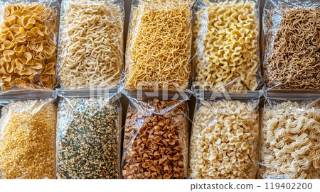 Assorted Packaged Pasta: Top View Display of Diverse Noodles Varieties in Clear Packaging 119402200