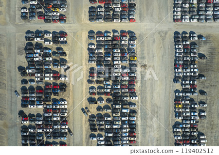 Aerial view of auction reseller company big parking lot with parked cars ready for remarketing services. Sales of secondhand vehicles 119402512