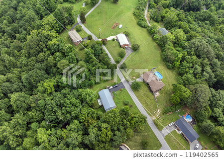 Aerial view of expensive residential houses in small town in rural Tennessee. American dream homes as example of real estate development in US suburbs Aerial view of expensive residential houses in small town in rural Tennessee. American dream homes as example of real estate development in US suburbs 119402565