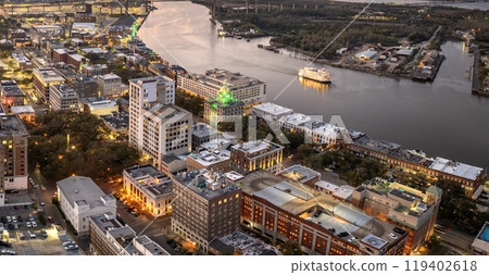 Aerial view of Savannah, old historical city in Georgia. River Street buildings architecture at night Aerial view of Savannah, old historical city in Georgia. River Street buildings architecture at night 119402618