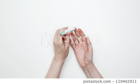 Woman using glucometer for testing level Blood sugar. Top view 119402911